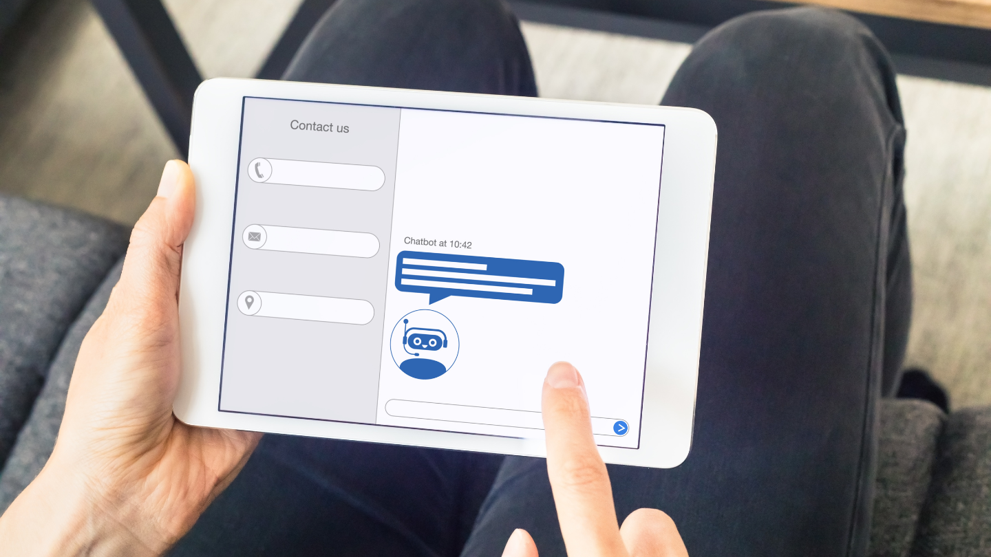 A person using a tablet to connect with a chatbot, having an AI interaction.
