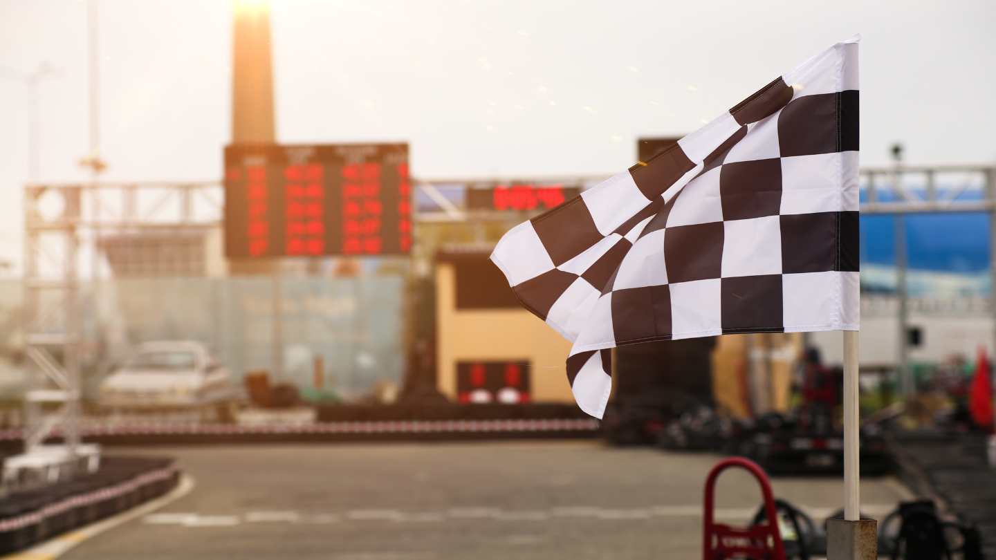 Checkered flag waving at the end of a race